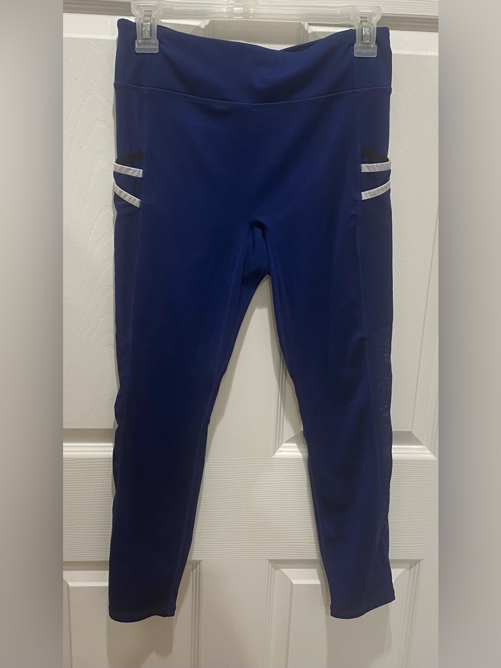 Women’s Fabletics  Navy Performance Leggings with sheer fabric on legs size M